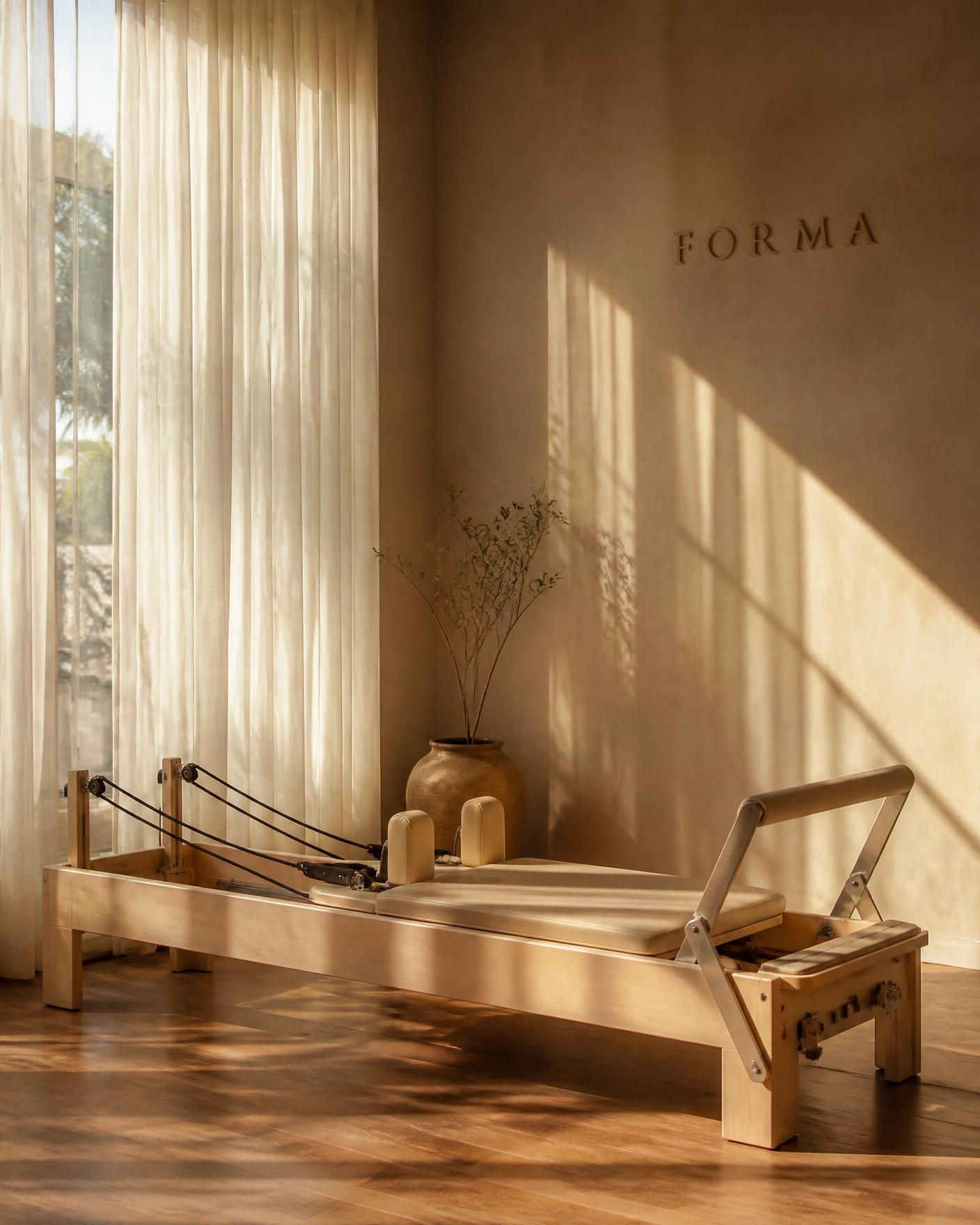 Empty reformer in warm late-afternoon studio light
